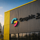 Building with 'Graphic Jet' logo and branding, Burj Khalifa visible in the background