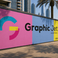 Colorful advertisement board for Graphic Jet Advertising with cityscape in the background