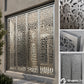 Decorative metal screen with intricate cut-out patterns on a building facade, featuring the GraphicJet logo.