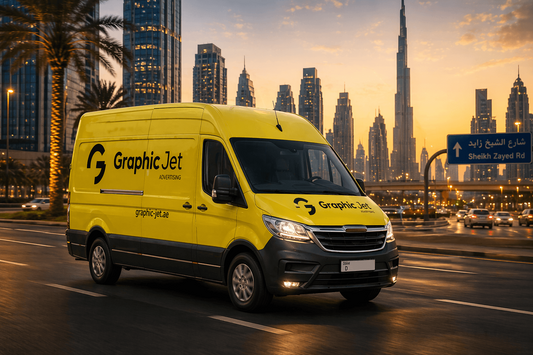Yellow van with 'Graphic Jet' branding on a Dubai city street with Burj Khalifa in the background